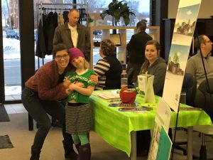 people gathered next to renderings of the store at our chosen location