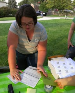 our first owner fills out the paperwork to purchase their shares