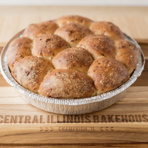 aluminum pan filled with fluffy brown rolls