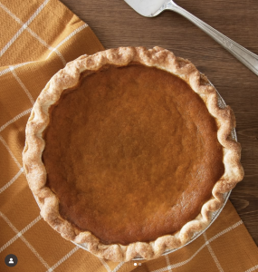 overhead photo of fresh pumpkin pie in a tin